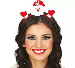 La fascia per capelli di Babbo Natale apre le mani