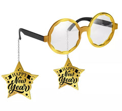 Buon anno con bicchieri dorati e stelle