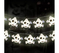 Guirnalda de Calaveras de plástico con luz de 5x4 cm