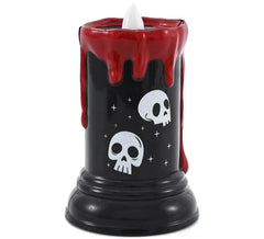 Candela a forma di teschio con luce e musica